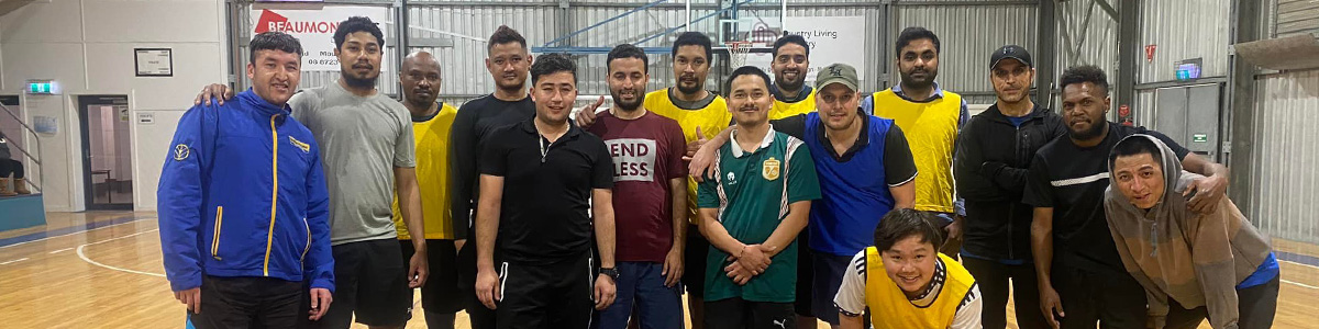 Team of men lining up on the basketball court