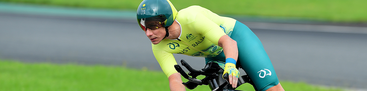 Darren Hicks rides his bike on the road