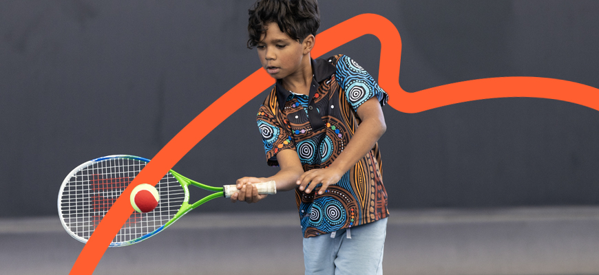 Boy playing tennis
