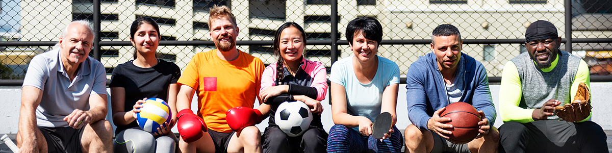 A group of people with sporting equipment